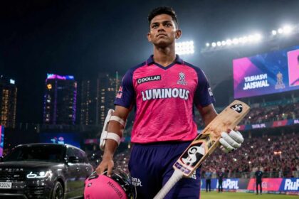 Yashasvi Jaiswal Net Worth 2026 featured image showing the Rajasthan Royals cricketer walking inside an IPL stadium with a cricket bat and luxury SUV